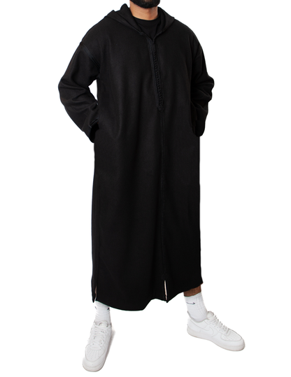 tall moroccan man wearing black thobe